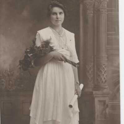 Graduation Photo of Young Woman with Flowers
