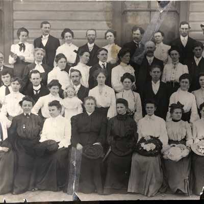 Clackamas District # 64 unidentified women and men outside building