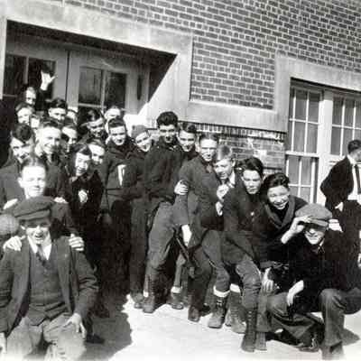 Unknown group of young men in front of an unknown building - no date