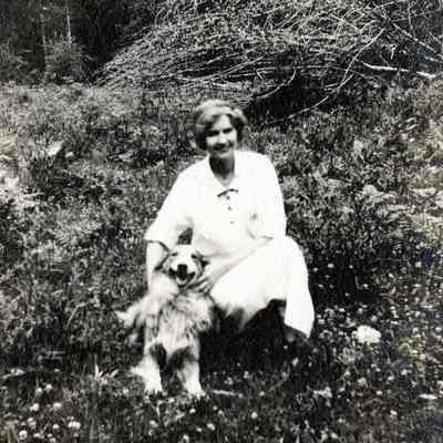 Unknown Women with Dog in Landscape