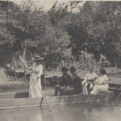 Women and Men in a Flat Bed Boat