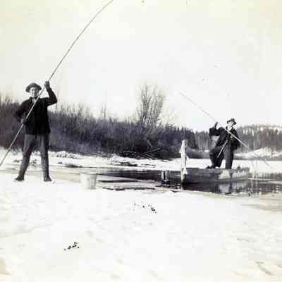 Two Unknown Men Fishing on Snowy Lake