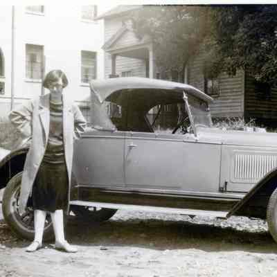 Unknown Woman Standing next to a Model A Roadster