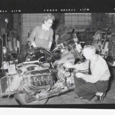 Two men working on Motorcyle