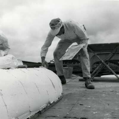 Worker Applying Plaster Grout, I-205 Bridge Construction.