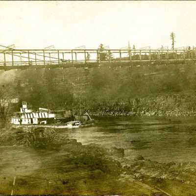 Steamboats Passing Beneath Suspension Bridge at Oregon City-West Linn.