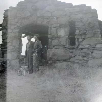 Two Men in Stone Shelter, Location Unknown.