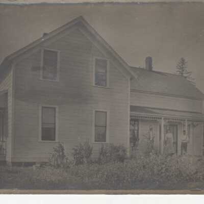 People on Porch of Farmhouse