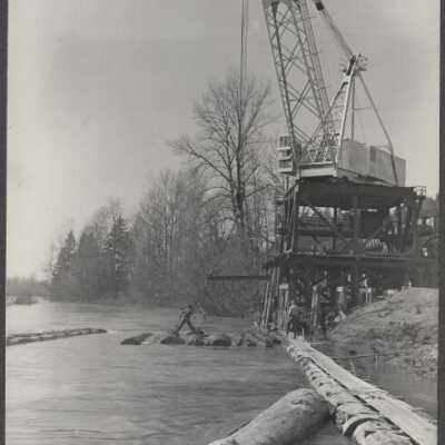 Logging Scene - Crane Lifting Logs Out of River - No Date or Location