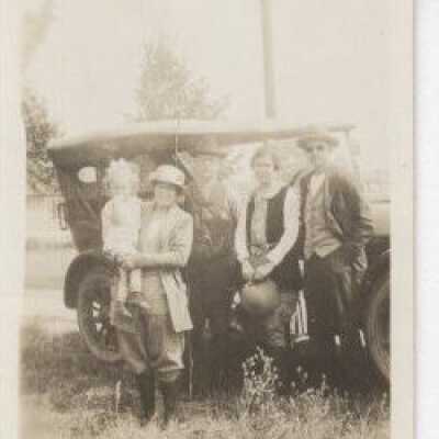 Group in front of a car