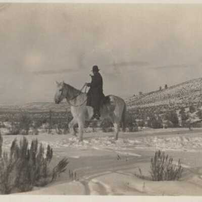 Man on Horse Walking in the Snow