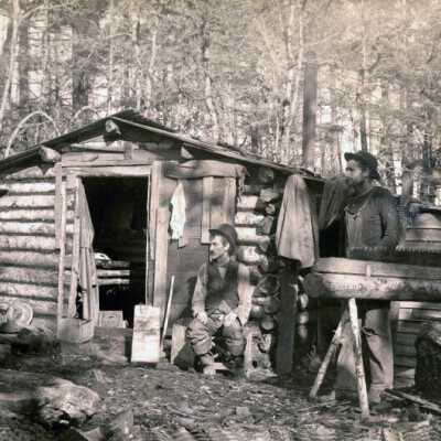 Three Men/Boy Outside Log Cabin.: Copyright: None; Origsize: 3"x5"; Origformat: Print-Photographic