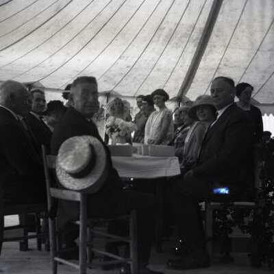 Group at Table in Large Tent.