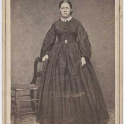 Woman Standing by a Chair - Portrait