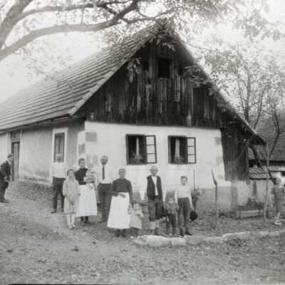 Photo of Family in Front of a house