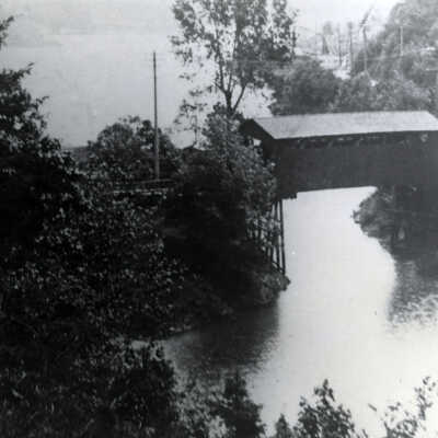 Iron Works Stack and Lower Sucker (Oswego) Creek Bridge.  (B) 1909: Copyright: None; Origsize: 8" x 10"; Origformat: Print-Photographic