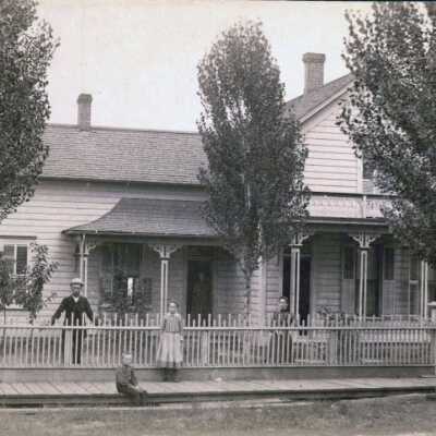 Unidentifed Home with family posed.: Copyright: None; Origsize: 3"x5"; Origformat: Print-Photographic