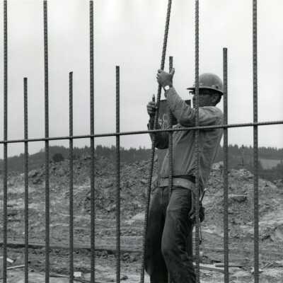 Worker with Steel Reinforcement for Concrete, I-205 Bridge Construction.