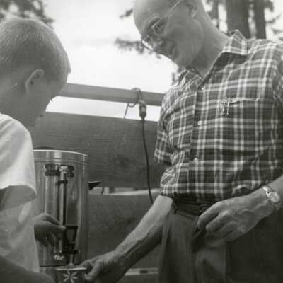 Boy Serving Man Coffee, 1960s.: Origformat: Print-Photographic