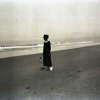 Woman Walking on Beach.