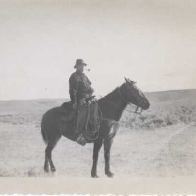Man on Horse Smoking Pipe