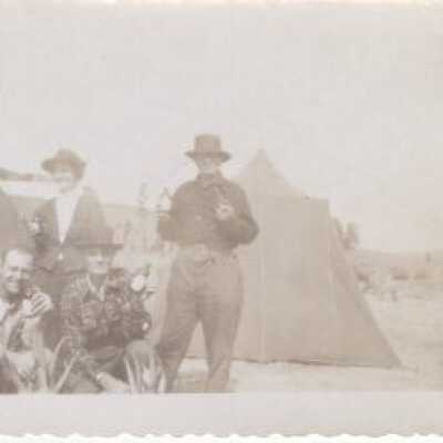 Unknown Persons In Front of Tents