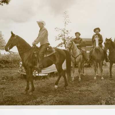 Four People on Horseback.