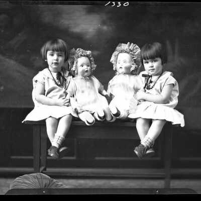 Photograph of twin girls with dolls for F.H. Wallace - December 1929 - Negative