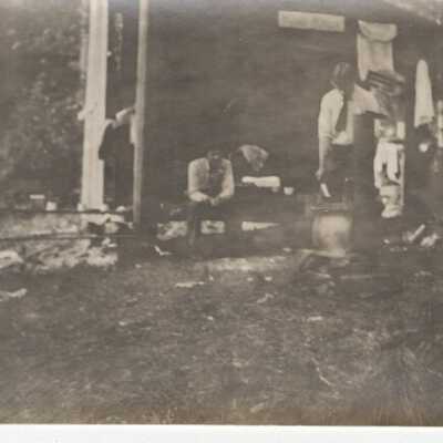 Men in front of Tent at Kamp Kelly