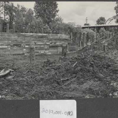 Wooden Wall with Bridge in Background 1952