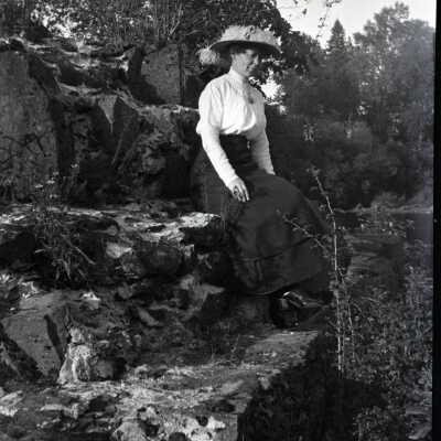 Nan Cochran Sitting on Rock Outcropping.