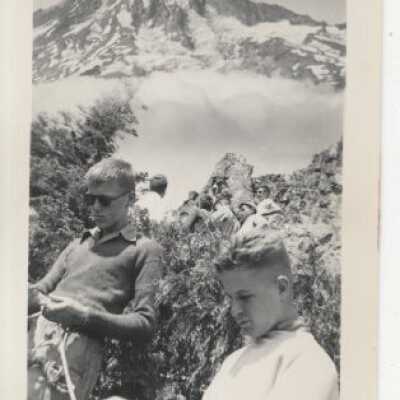 Mt. Rainier - Two Men standing at the Base of Mt. Rainier