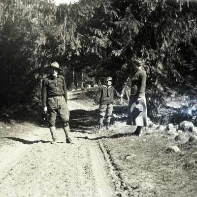 Man, woman and Boy on Road.