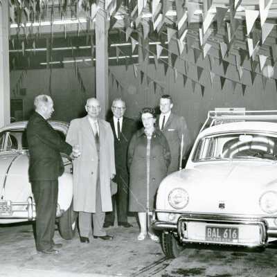 Two Men shaking Hands at Car Dealership.