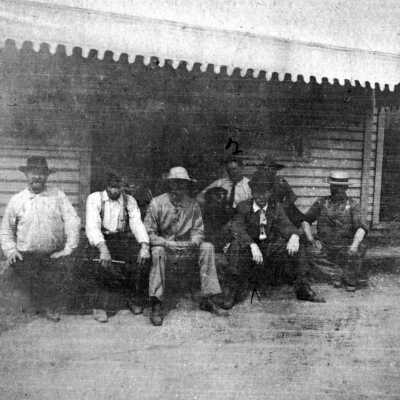 Postcard of Group on Stoop of Wilsonville Bar.