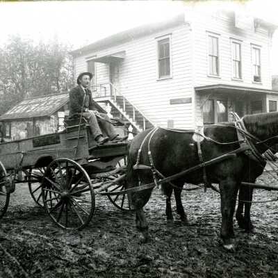 Man on Wagon Pulled by Two-horse Team