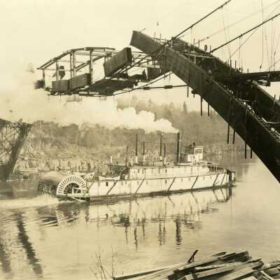 Sternwheeler Passing Under Construction of Oregon City Arch Bridge.