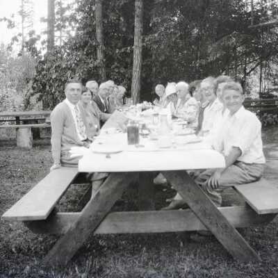 Group at Picnic Table, Camp Adams.