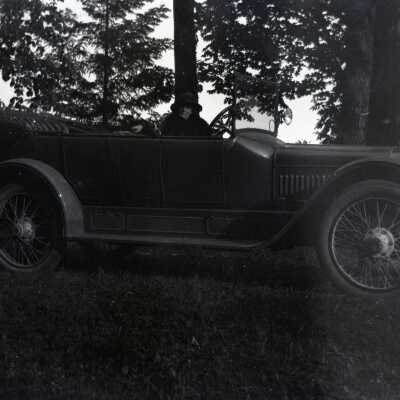 Woman in Open Car.
