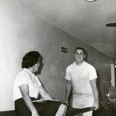 Woman and Man with Stretcher.