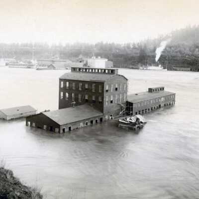1890 Flood - Wood Grinding Plant with "Three Sisters" Steamboat in Background.