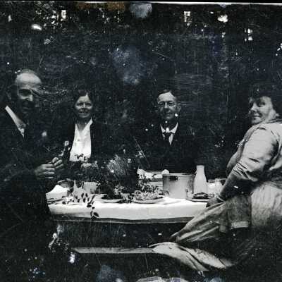 Four People at Picnic Table (Camp Adams).