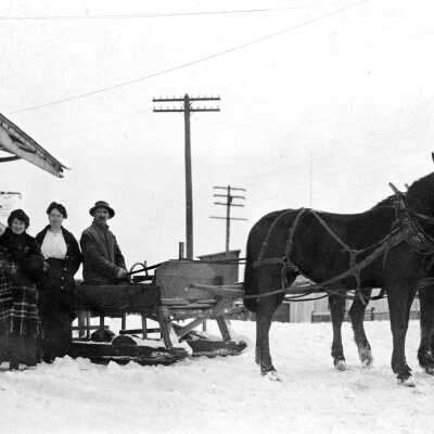 Horse Team and Sled in Front of Everhart and Hall Grocery Store