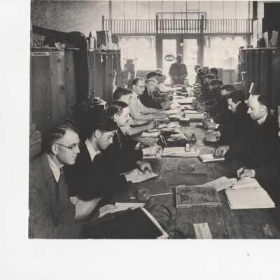 Meeting with people taking notes