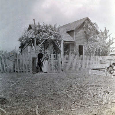 Unidentified Home with two women out front.