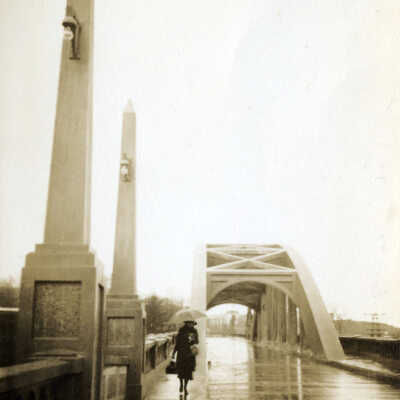 Pedestrian on Arch Bridge.