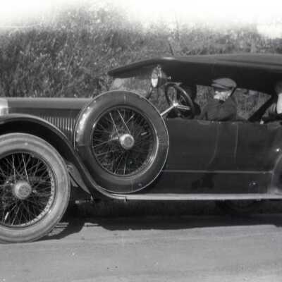People Seated in Car.