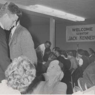 JFK Talking to Lady at Clackamas County Banquet. (#2)