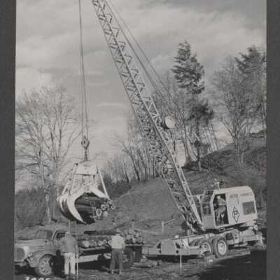 Logging Scene - Log Truck being loaded by crane with Logs - No Date or Location