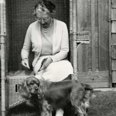 Miriam (unidentified last name) with Cocker Spaniel.: Origsize: 8" x 10"; Origformat: Print-Photographic